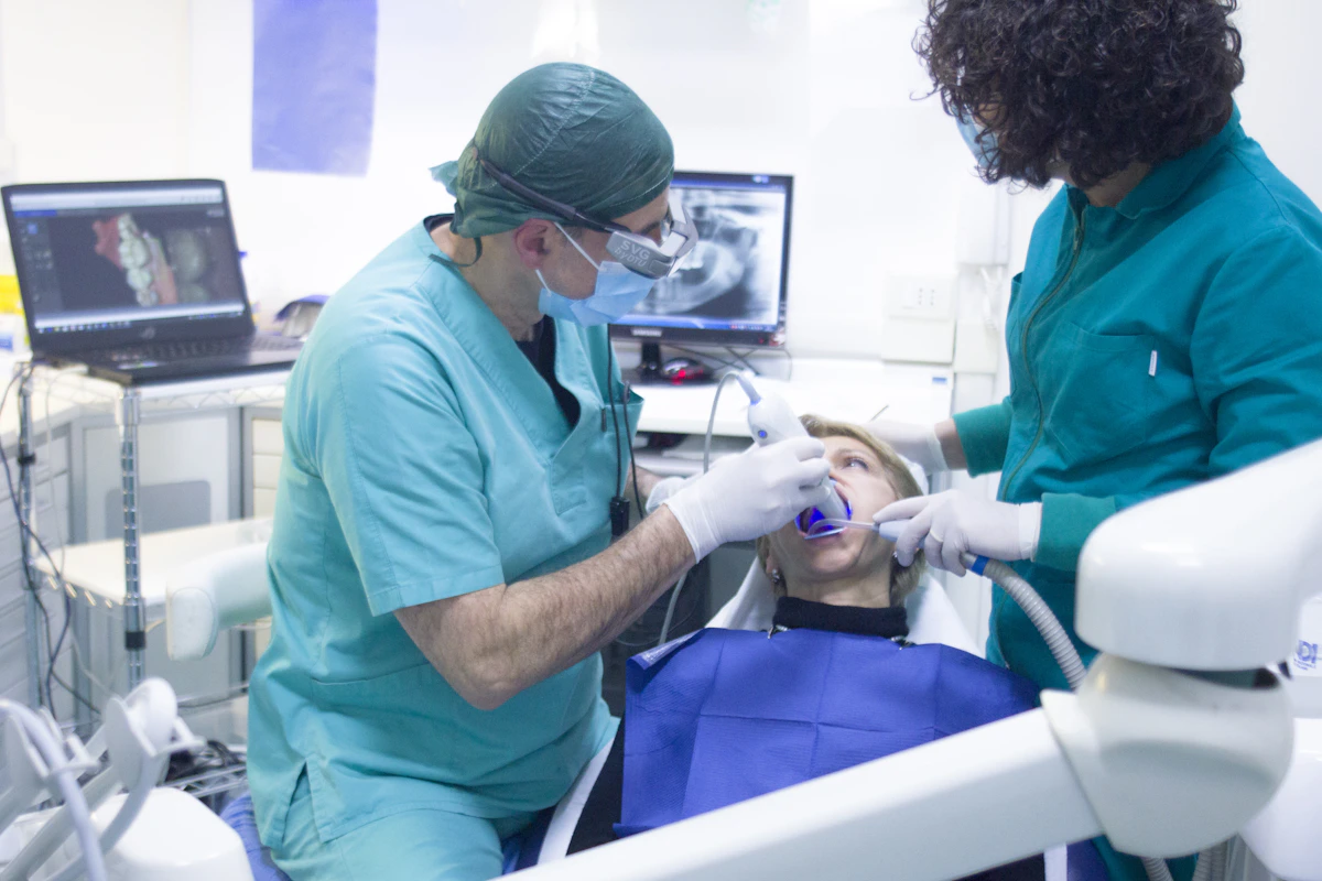 Professional dentist in teal scrubs at Lagos dental clinic