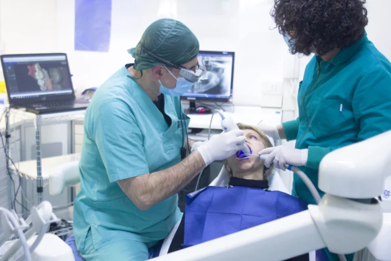 Professional dentist in teal scrubs at Lagos dental clinic